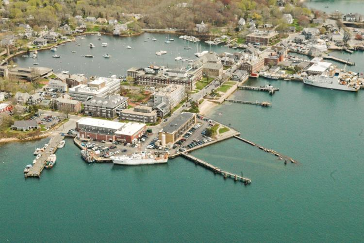  Aerial view of NMFS building, surrounding wharves and Eel Pond; Woods Hole, Mass.